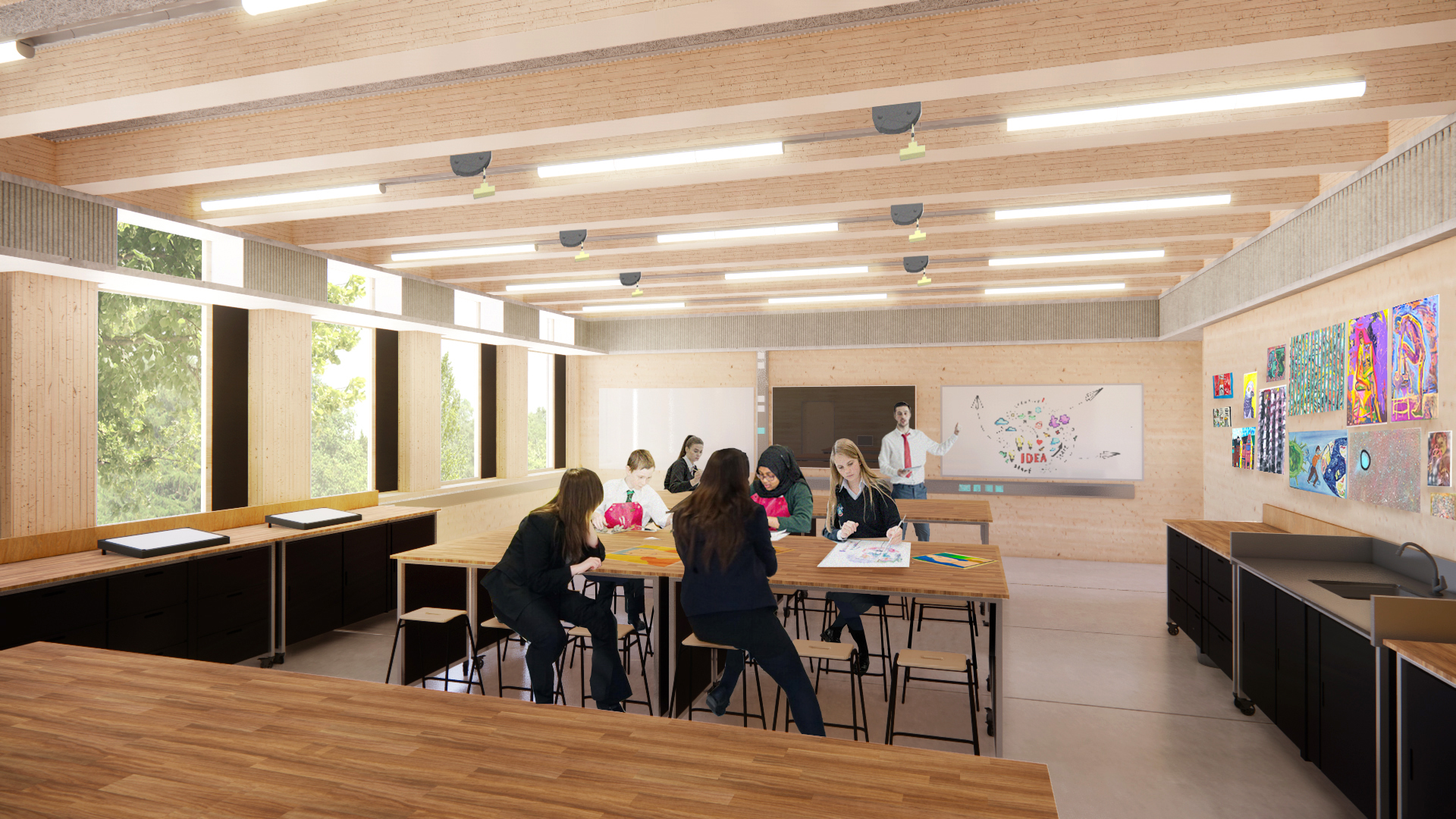 A modern classroom with wooden tables and large windows hosts several students engaging in crafts and writing. A teacher stands by a whiteboard adorned with colorful drawings and CAD designs. The room is well-lit, organized, and abuzz with creative energy.