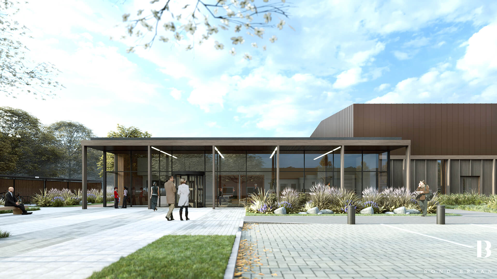 A modern building with a glass facade and brown accents, enhanced by BIM technology, stands amidst grass and shrubs. People walk and sit nearby under a partly cloudy sky, while the foreground reveals a paved area with a lone tree branch overhead.
