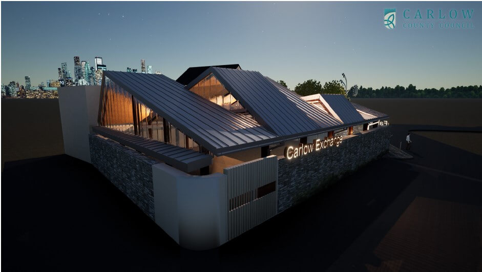 A modern, triangular-roofed building with large windows and stone accents, illuminated at night by intricate lighting envisioned by the architect. The sign reads Carlow Exchange, with a city skyline in the background. It feels like stepping into an Archicad masterpiece.