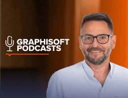 A smiling man with glasses and a beard stands in front of a blurred orange and brown background, next to the Graphisoft Podcasts logo featuring a microphone icon.