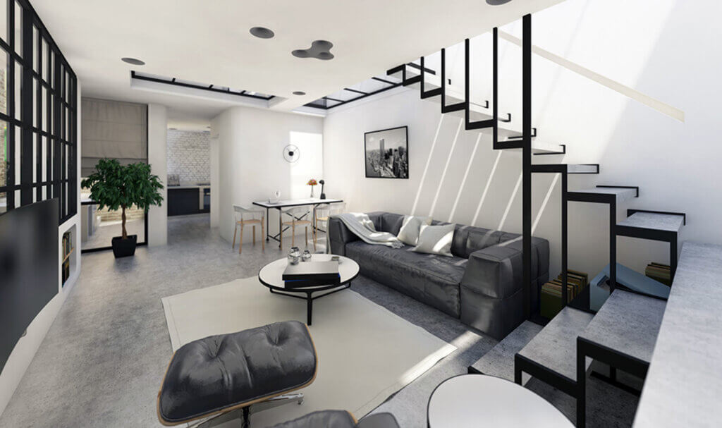 Modern, minimalist living room with a gray sofa, coffee tables, and lounge chair under an open staircase. Black-and-white decor, large windows, and a dining area lead to a kitchen in the background. Sunlight brightens the space.