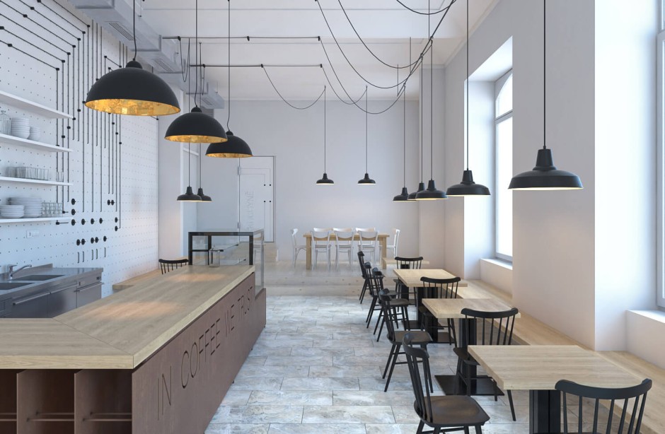 Minimalist coffee shop interior with wooden tables, black chairs, large windows, and black pendant lights hanging from the ceiling. Shelves with dishes line one wall, and a wooden counter is on the left.